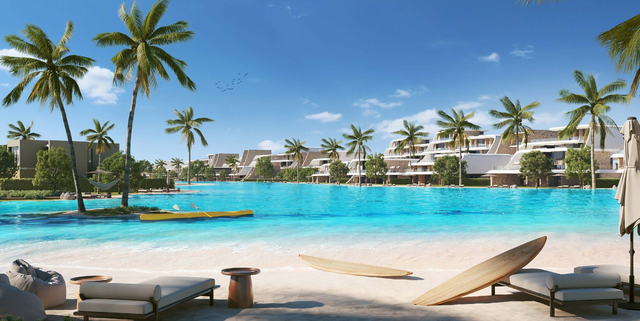 A crystal lagoon beach with loungers and palms at Azha Ras El Hekma