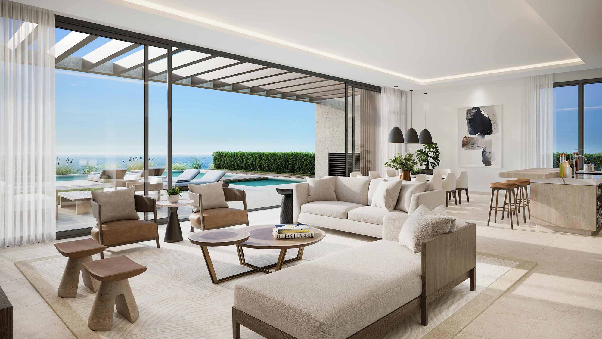 An open-plan living room opening to the pool and sea at Silversands